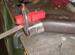 Tack welding the cut sections together. I clamped it to a bar, to ensure the parts were aligned.